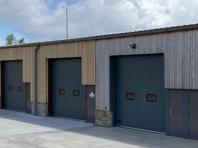 Shadow Gap mature next to fresh 173 British Cedar Cladding Grey colour against new cedar 173